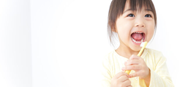 A child brushing her teeth